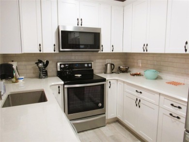 Come see this absolutely stunning and meticulously maintained 2 on East Bay Golf Club in Florida - for sale on GolfHomes.com, golf home, golf lot