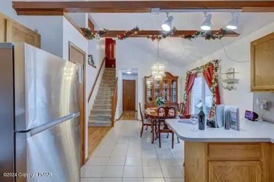 This beautiful contemporary home is a great investment property on Pocono Farms Country Club in Pennsylvania - for sale on GolfHomes.com, golf home, golf lot