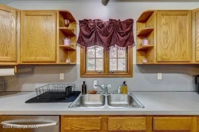 This beautiful contemporary home is a great investment property on Pocono Farms Country Club in Pennsylvania - for sale on GolfHomes.com, golf home, golf lot