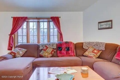 This beautiful contemporary home is a great investment property on Pocono Farms Country Club in Pennsylvania - for sale on GolfHomes.com, golf home, golf lot