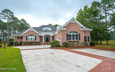 Gorgeous custom brick home sitting on a private .48/acre cul de on Ocean Ridge Plantation in North Carolina - for sale on GolfHomes.com, golf home, golf lot