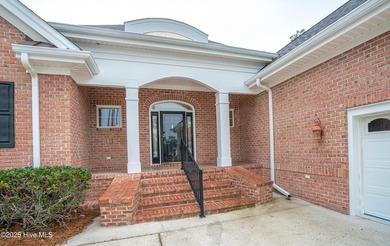 Gorgeous custom brick home sitting on a private .48/acre cul de on Ocean Ridge Plantation in North Carolina - for sale on GolfHomes.com, golf home, golf lot