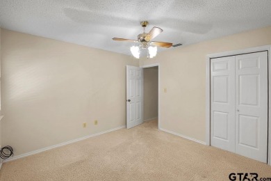 Nestled among mature trees, this charming 3 bedroom, 2 bath home on Hide-A-Way Lake Golf Course in Texas - for sale on GolfHomes.com, golf home, golf lot