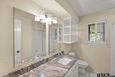 Nestled among mature trees, this charming 3 bedroom, 2 bath home on Hide-A-Way Lake Golf Course in Texas - for sale on GolfHomes.com, golf home, golf lot