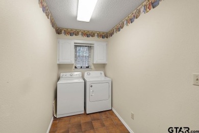 Nestled among mature trees, this charming 3 bedroom, 2 bath home on Hide-A-Way Lake Golf Course in Texas - for sale on GolfHomes.com, golf home, golf lot