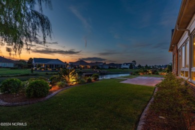 Experience luxury coastal living in the serene community of on Compass Pointe Golf Course in North Carolina - for sale on GolfHomes.com, golf home, golf lot