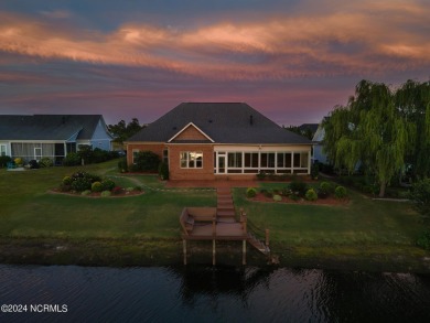 Experience luxury coastal living in the serene community of on Compass Pointe Golf Course in North Carolina - for sale on GolfHomes.com, golf home, golf lot