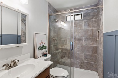 Discover effortless Florida living in this beautifully updated on Tiger Point Golf and Country Club in Florida - for sale on GolfHomes.com, golf home, golf lot