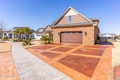 Experience luxury coastal living in the serene community of on Compass Pointe Golf Course in North Carolina - for sale on GolfHomes.com, golf home, golf lot