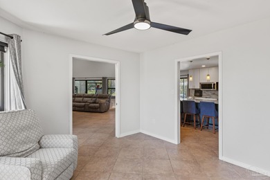 Discover effortless Florida living in this beautifully updated on Tiger Point Golf and Country Club in Florida - for sale on GolfHomes.com, golf home, golf lot