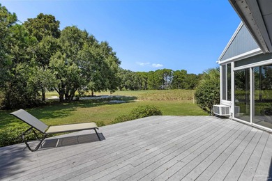 Discover effortless Florida living in this beautifully updated on Tiger Point Golf and Country Club in Florida - for sale on GolfHomes.com, golf home, golf lot