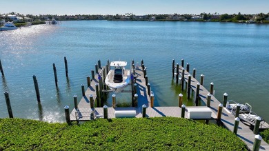 Experience the best of luxury living in this waterfront coastal on Sailfish Point Golf Club, Inc. in Florida - for sale on GolfHomes.com, golf home, golf lot