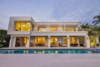 Experience the best of luxury living in this waterfront coastal on Sailfish Point Golf Club, Inc. in Florida - for sale on GolfHomes.com, golf home, golf lot