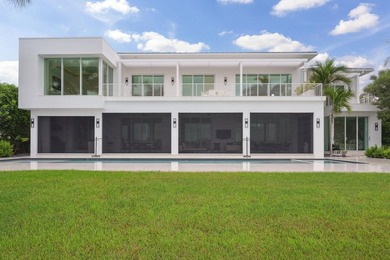 Experience the best of luxury living in this waterfront coastal on Sailfish Point Golf Club, Inc. in Florida - for sale on GolfHomes.com, golf home, golf lot