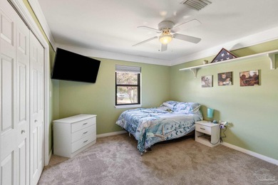 Discover effortless Florida living in this beautifully updated on Tiger Point Golf and Country Club in Florida - for sale on GolfHomes.com, golf home, golf lot