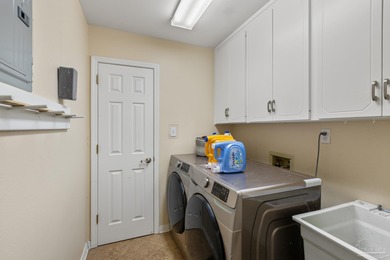 Discover effortless Florida living in this beautifully updated on Tiger Point Golf and Country Club in Florida - for sale on GolfHomes.com, golf home, golf lot