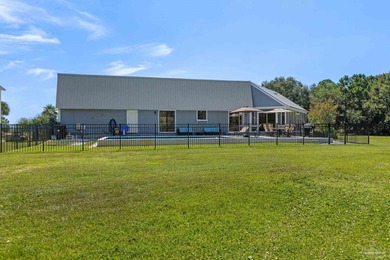 Discover effortless Florida living in this beautifully updated on Tiger Point Golf and Country Club in Florida - for sale on GolfHomes.com, golf home, golf lot