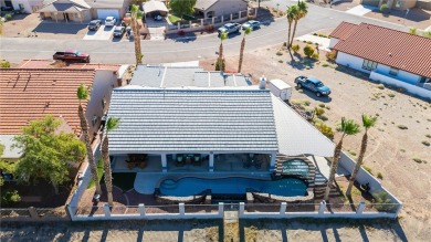 Live like you are on vacation every day in this resort-like on Desert Lakes Golf Course in Arizona - for sale on GolfHomes.com, golf home, golf lot