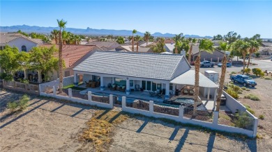 Live like you are on vacation every day in this resort-like on Desert Lakes Golf Course in Arizona - for sale on GolfHomes.com, golf home, golf lot