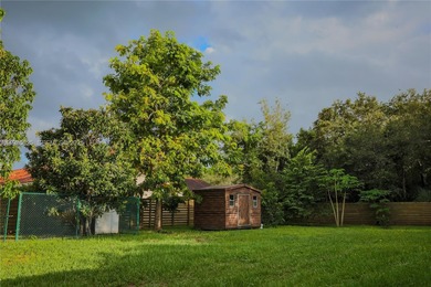 Tucked away on a peaceful dead-end street just blocks from on Killian Greens Golf Club in Florida - for sale on GolfHomes.com, golf home, golf lot
