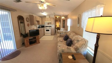 TWO BED, ONE BATH HOME IN ACTIVE 55+ COMMUNITY! This furnished on River Run Golf Links in Florida - for sale on GolfHomes.com, golf home, golf lot