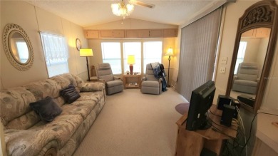 TWO BED, ONE BATH HOME IN ACTIVE 55+ COMMUNITY! This furnished on River Run Golf Links in Florida - for sale on GolfHomes.com, golf home, golf lot