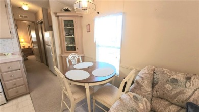 TWO BED, ONE BATH HOME IN ACTIVE 55+ COMMUNITY! This furnished on River Run Golf Links in Florida - for sale on GolfHomes.com, golf home, golf lot