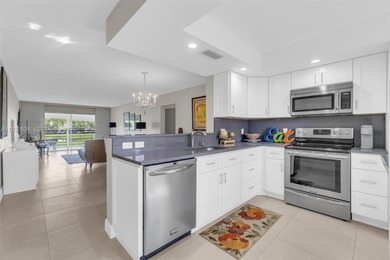 Discover this beautifully remodeled residence where elegance on Wynmoor Golf Course in Florida - for sale on GolfHomes.com, golf home, golf lot