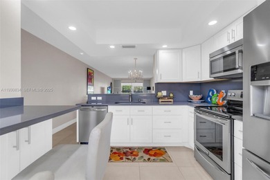 Discover this beautifully remodeled residence where elegance on Wynmoor Golf Course in Florida - for sale on GolfHomes.com, golf home, golf lot