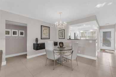 Discover this beautifully remodeled residence where elegance on Wynmoor Golf Course in Florida - for sale on GolfHomes.com, golf home, golf lot