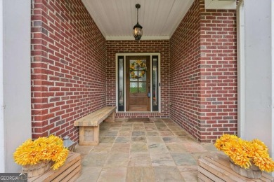 Welcome home to this beautiful all-brick ranch in the on Canongate At Georgia National Golf Club in Georgia - for sale on GolfHomes.com, golf home, golf lot