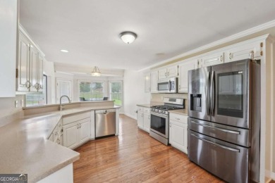 Welcome home to this beautiful all-brick ranch in the on Canongate At Georgia National Golf Club in Georgia - for sale on GolfHomes.com, golf home, golf lot