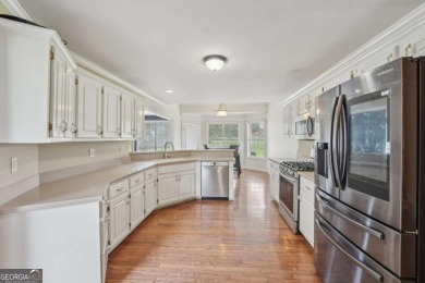 Welcome home to this beautiful all-brick ranch in the on Canongate At Georgia National Golf Club in Georgia - for sale on GolfHomes.com, golf home, golf lot