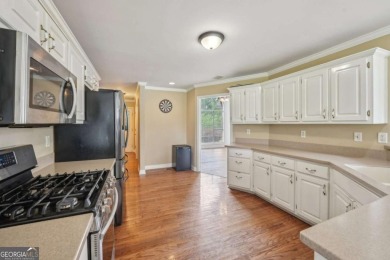 Welcome home to this beautiful all-brick ranch in the on Canongate At Georgia National Golf Club in Georgia - for sale on GolfHomes.com, golf home, golf lot