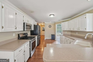 Welcome home to this beautiful all-brick ranch in the on Canongate At Georgia National Golf Club in Georgia - for sale on GolfHomes.com, golf home, golf lot