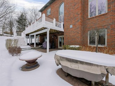 This stunning brick colonial masterpiece sits on a large on Farmington Hills Golf Club in Michigan - for sale on GolfHomes.com, golf home, golf lot