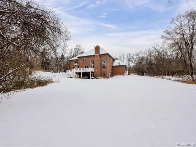 This stunning brick colonial masterpiece sits on a large on Farmington Hills Golf Club in Michigan - for sale on GolfHomes.com, golf home, golf lot