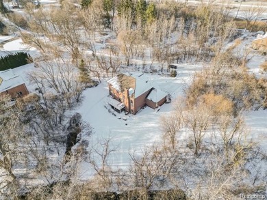 This stunning brick colonial masterpiece sits on a large on Farmington Hills Golf Club in Michigan - for sale on GolfHomes.com, golf home, golf lot