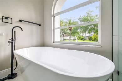 Completely renovated 4-bedroom 3-bathroom home located in on Heritage Harbor Golf and Country Club in Florida - for sale on GolfHomes.com, golf home, golf lot