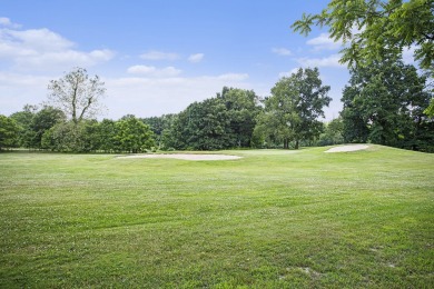 Welcome to this spacious 4-bedroom, 2.5-bath set on nearly half on Lake Doster Golf Club in Michigan - for sale on GolfHomes.com, golf home, golf lot