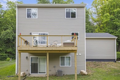 Welcome to this spacious 4-bedroom, 2.5-bath set on nearly half on Lake Doster Golf Club in Michigan - for sale on GolfHomes.com, golf home, golf lot