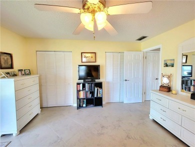 Meticulously maintained end unit with updated kitchen and baths on The American Golf Club in Florida - for sale on GolfHomes.com, golf home, golf lot