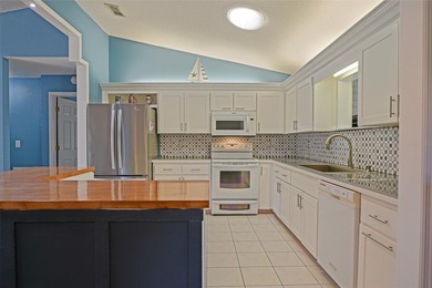 This beautifully updated and expanded Holly model offers 3 on The Links of Spruce Creek in Florida - for sale on GolfHomes.com, golf home, golf lot