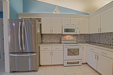 This beautifully updated and expanded Holly model offers 3 on The Links of Spruce Creek in Florida - for sale on GolfHomes.com, golf home, golf lot