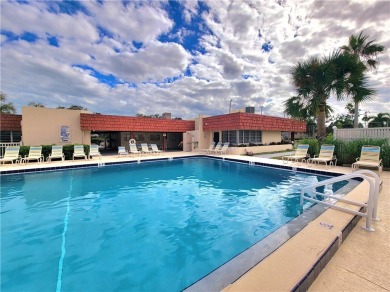 Meticulously maintained end unit with updated kitchen and baths on The American Golf Club in Florida - for sale on GolfHomes.com, golf home, golf lot