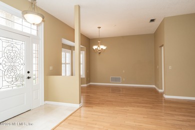 Beautifully maintained one story, 3 bedroom,2 bathroom home on Jacksonville Golf and Country Club in Florida - for sale on GolfHomes.com, golf home, golf lot