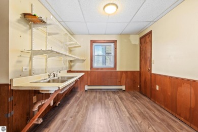 Located just within the city limits, this home offers character on Traverse City Golf and Country Club in Michigan - for sale on GolfHomes.com, golf home, golf lot