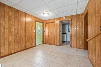 Located just within the city limits, this home offers character on Traverse City Golf and Country Club in Michigan - for sale on GolfHomes.com, golf home, golf lot