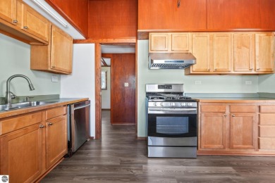 Located just within the city limits, this home offers character on Traverse City Golf and Country Club in Michigan - for sale on GolfHomes.com, golf home, golf lot