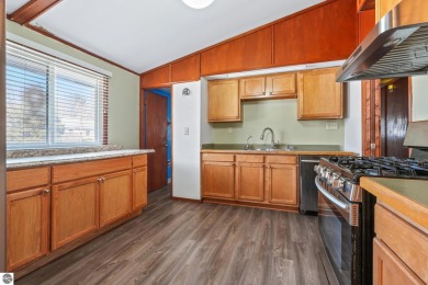 Located just within the city limits, this home offers character on Traverse City Golf and Country Club in Michigan - for sale on GolfHomes.com, golf home, golf lot